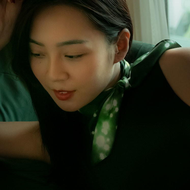 Woman wearing a silk scarf from a friend of mine made in japan. Paris Nuit foulard.