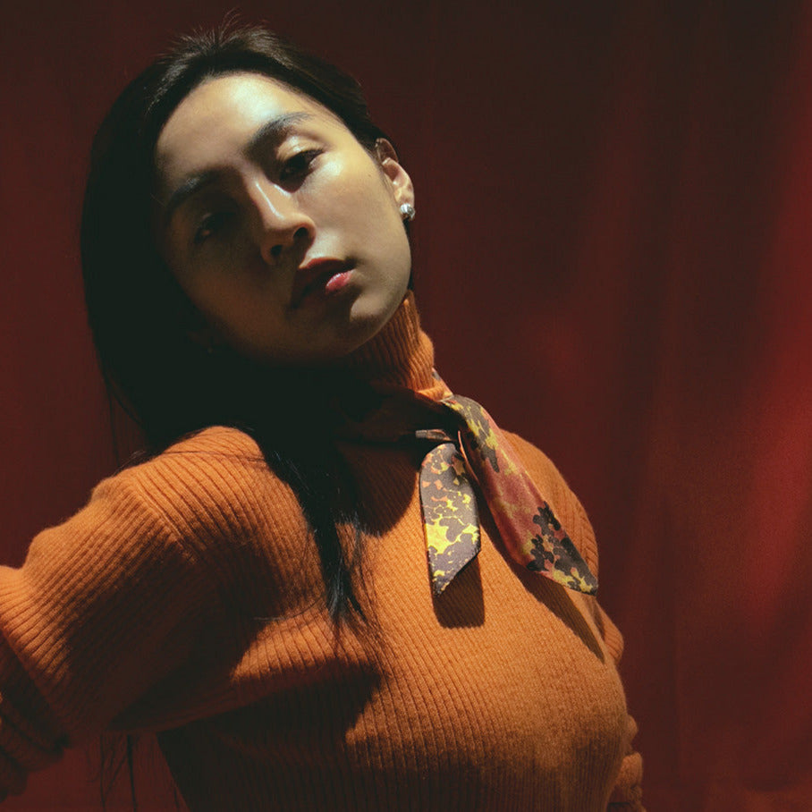 Woman in silk scarf Calvin Lauren from a friend of mine, scarf made in japan. French chic scarf styles.