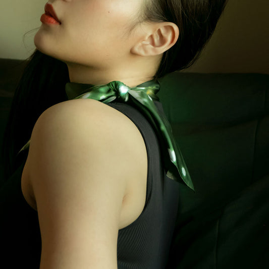 Woman wearing a silk scarf from a friend of mine made in japan. Paris Nuit foulard.