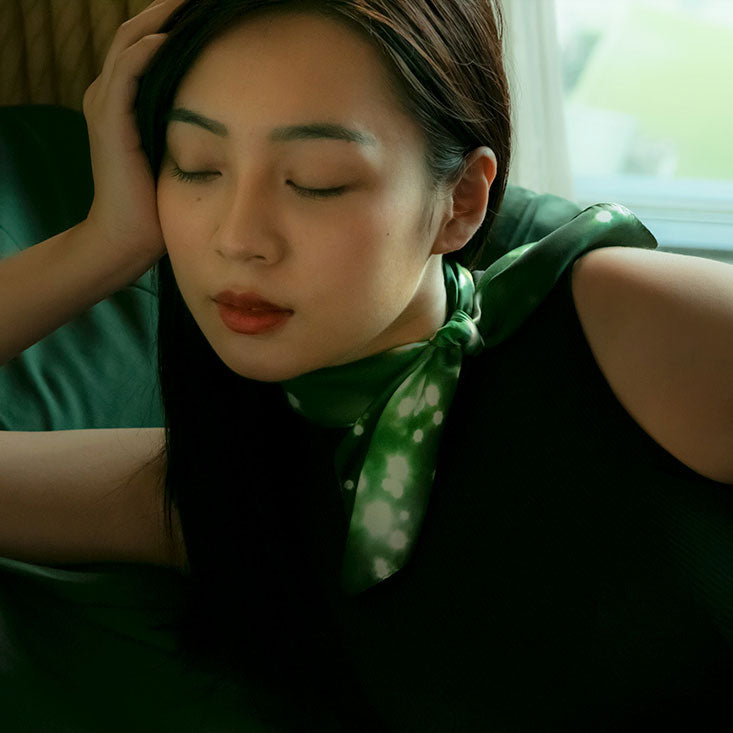 Woman wearing a silk scarf from a friend of mine made in japan. Paris Nuit foulard.